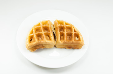 Waffle on white dish on white background