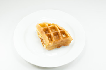 Waffle on white dish on white background