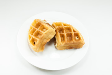 Waffle on white dish on white background