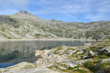 Panoramic view of the "Lago della Vacca" between the Adamello mountains in the Alps