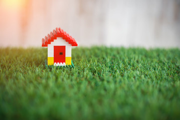 model of plastic house building on grass.jpg