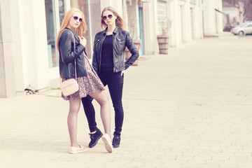 Two fashion styled friends in outdoor shooting
