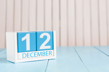 December 12th. Day 12 of month, calendar on wooden background. Winter time. Empty space for text