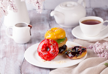 Tasty donut with a cup of coffee