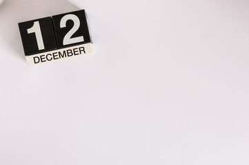 December 12th. Day 12 of month, calendar on white background. Winter time. Empty space for text