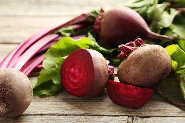 Fresh beets on a grey wooden table