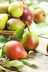 Ripe pears on grey wooden table