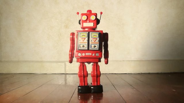 vintage red robot marching spinning and shooting 