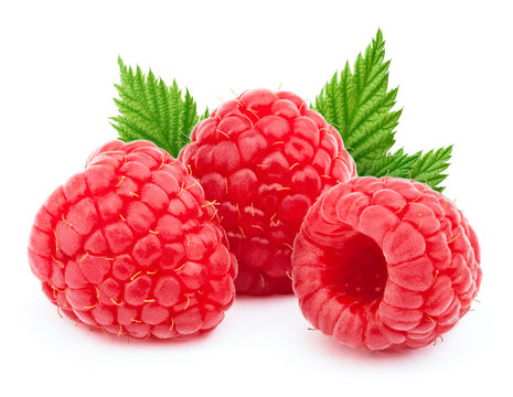Three ripe raspberries with green leaves isolated on white background with clipping path