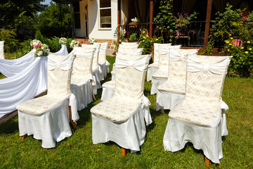 Wedding ceremony decorations. Chairs close up