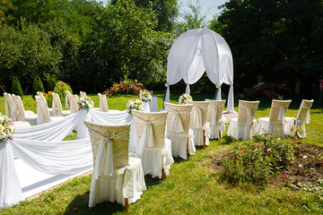Wedding ceremony decorations in the park at sunny day