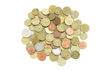 Heap of different Euro coins isolated on white background, viewed from above.