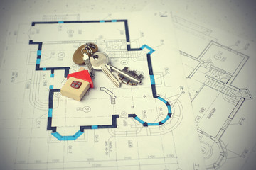Closeup of keys on blueprint of new home. copy space