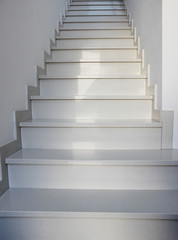 Empty white stairs