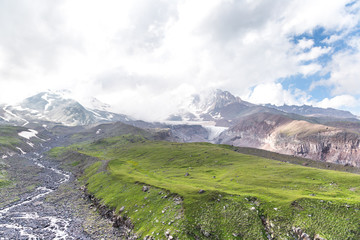 Mountain landscape, alpine meadows on a background of Kazbek, Caucasus, Georgia. 