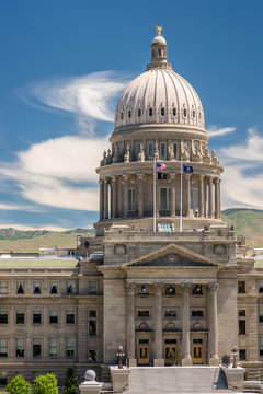 Close up of the Idaho State capital building with flags