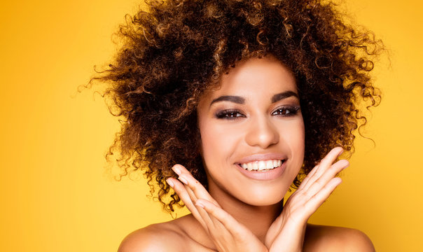 Beauty portrait of smiling girl with afro.