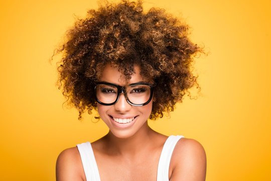 Laughing african american girl with afro.