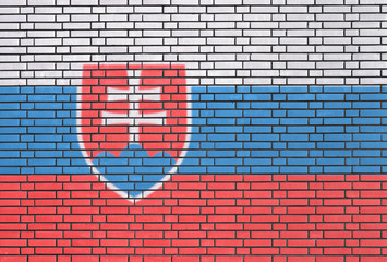 Slovak flag painted on brick wall