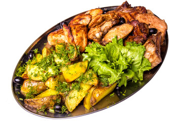 Grilled chicken wings and legs with lettuce and black olives