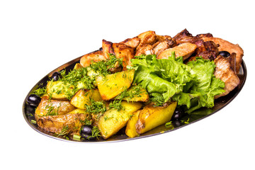 Grilled chicken wings and legs with lettuce and black olives