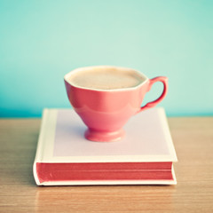 Coffee cup over hardcover book - 117677837