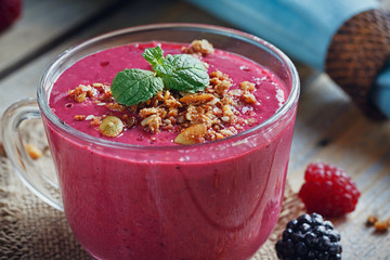 Delicious blackberry and raspberry smoothie, detox yogurt or mil