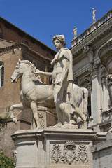 Obraz premium Castor or Pollux. Ancient marble statue of Dioskouri at the top of monumental balustrade in Capitoline Hill, Rome
