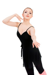 Young beautiful dancer posing on isolated white studio background. Pretty woman - modern style dancer or ballerina in ballet pose.