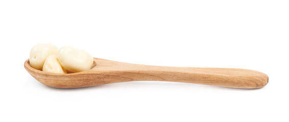 Spoon of chocolate candies isolated