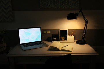 Stylish workplace with laptop at home