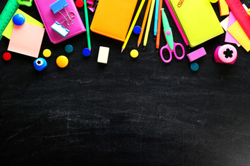 Colourful stationery on black background