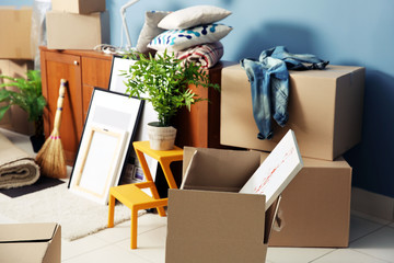 Packed household goods for moving into new house - obrazy, fototapety, plakaty