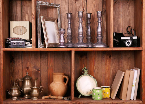 Wooden shelves with antiques things