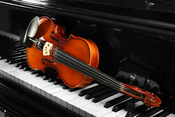 Violin on piano keys, closeup
