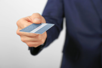 Businessman with credit card, closeup