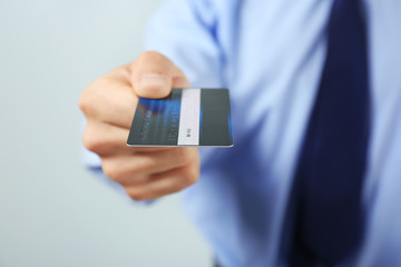 Businessman with credit card, closeup