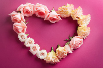 Heart shaped roses on purple background