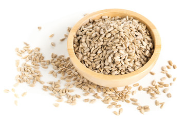 Shelled sunflower seeds in wooden bowl