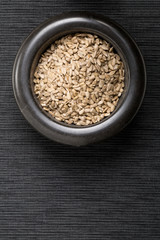 Shelled sunflower seeds in black mortar