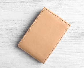 Leather wallet on wooden background