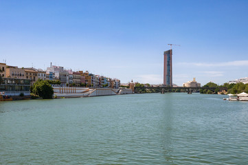 Fototapeta na wymiar View of Guadalquivir River and Triana Bridge in Seville
