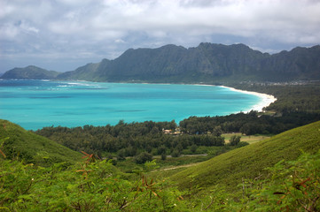The azure blue ocean of Waimanalo Bay lined by white-sand beach on Oahu, Hawaii