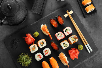 Sushi set and chopsticks on slate plate