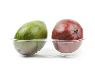 Two mango fruits in a plastic case