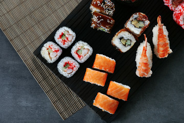 Sushi roll set on wooden board
