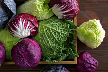 Fresh cabbage in wooden crate, closeup