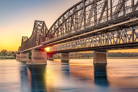 Fototapeta Anghel Saligny bridge spans the Danube near Cernavoda, Romania. When finished in 1895 it became the longest bridge in Europe and the 3rd longest in the world