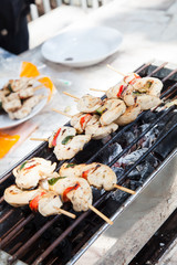 Chicken barbecue grilling on charcoal