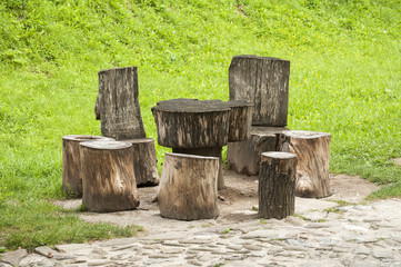 Wooden table and chairs made from whole  tree stumps